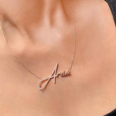 Our Signature Style Name Necklace with Diamond is absolutely stunning thanks to lots of lovely touches that combine to create a one-of-a-kind pendant that celebrates life, family, or love. A layering essential, it showcases elegant script font, a slim chain, and an initial with artificial diamond. Handcrafted of Sterling Silver, this necklace features: 1 personalized name Delicate handwriting script font Matching chain Description: Material: 14k White Gold Plated Sterling Silver 0.925/14k yellow Font Matching, Diamond Name Necklace, First Letter Of Your Name, Handwriting Script, Name Necklace Silver, Necklace With Diamond, Elegant Script Fonts, Name Pendant, Nameplate Necklace