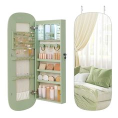 an open green cabinet next to a white couch