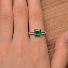 It is a lab emerald ring. The main stone is 7mm*7mm square cut, weight about 1.62 carats. The basic metal is sterling silver and plated with rhodium. To change the metal to a solid gold (white/rose) or platinum is also available, please ask for a quotation if you want. You can also go to my shop Home for more elegant rings: https://www.etsy.com/shop/godjewelry?ref=hdr_shop_menu More rings: https://www.etsy.com/shop/godjewelry?ref=l2-shop-header-avatar Customization is always welcome and please f Sterling Silver Emerald Radiant Cut Promise Ring, Emerald Cut Sterling Silver Solitaire Birthstone Ring, Silver Rectangular Emerald Ring With Center Stone, Emerald Cut Solitaire Birthstone Ring In Sterling Silver, Square Cut Solitaire Emerald Ring For Promise, Solitaire Square Cut Emerald Promise Ring, Square Cut Emerald Ring With Diamond For Promise, Square Cut Solitaire Emerald Promise Ring, Silver Radiant Cut Emerald Ring For May Birthstone