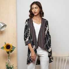 (Free Shipping for Min. Purchase $200 and Free Gift) Please make sure to read the description & our policy before checking out. This batik outer / blazer is made from 100% cotton fabric. The outer has been handcrafted using traditional techniques. The result is a beautiful piece of clothing that will last for years to come. This blazer is perfect for casual wear or as office attire.  - Unique design - Soft and comfortable Our Measurements for This Product: Chest Circumference: 98cm Body Length: Spring Batik Print Long Sleeve Kimono, Spring Bohemian Outerwear With Batik Print, Casual Long Sleeve Outerwear With Batik Print, Casual Long Sleeve Batik Print Outerwear, Casual Spring Outerwear With Batik Print, Casual Batik Print Outerwear For Spring, Casual Batik Print Outerwear For Fall, Outer Blazer, Batik Outer