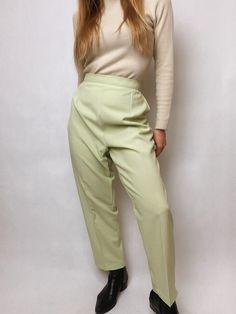 Vintage women pants *Probably from 1990's *Classic elegant look *Willow green color *Material: 100% Polyester *Perfect vintage condition (no flaws) *Rubber in waist, so pants are adjustable and comfortable Size: Large (model in photos is size Small; the pants were adjusted to her waist and pinned in the back) Waist (stretches): 30,75 inch / 78 cm Hips: 43 1/4 inch / 110 cm Rise: 13,75 inch / 35,5 cm Thigh: 26 inch / 66 cm Inner leg: 27,5 inch / 70 cm Outer leg: 38,25 inch / 97 cm Leg opening: 15 Classic Green High-waisted Pants, Green Ankle-length Pants For Spring, Classic Green Tapered Leg Bottoms, Green Trousers For Work, Vintage Ankle-length Workwear Bottoms, Classic Green Straight Leg Pants, Green High-waisted Dress Pants With Pockets, Vintage Ankle-length Pants For Work, Green Classic Straight Pants