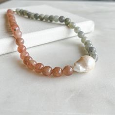 "This genuine Baroque Pearl, Labradorite and Sunstone gemstones necklace is perfect as gift for your loved ones or just for you. Treat your beloved ones and send some good vibes to your mom, mother in law or auntie ♥ It will absolutely be a meaningful gift for Mothers Day! ● LENGTH: 2 options available, 16\" / 40 cm or 18\" / 45 cm. ● MATERIAL: High quality 925k Sterling Silver on chains (Hypoallergenic). Sterling Silver 925k or 22k Gold Fill Sterling Silver) to choose from. The beads are made o Gift For Mothers Day, Baroque Pearl Necklace, Freshwater Pearl Necklace, Freshwater Pearl Necklaces, Mother In Law, Necklace Sterling Silver, 22k Gold, Baroque Pearls, Necklace Gift