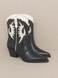 Introducing our Bold Fashion Houston Layered Panel Cowboy Boots - the perfect blend of classic cowboy style and modern attitude. These boots feature multi-layered panels that bring a touch of rodeo spirit to any occasion, making a bold fashion statement. Step out with their Western charm and stand out at any festival. Color: Black, Taupe or White Made of: Vegan Leather Brand: Oasis Society Includes: x1 Pair of Boots Sizes: 6, 6.5, 7, 7.5, 8.5, 9, 10 Shaft Height: 7.5"Heel Height: 2.5" Shoe Openi Western Style Mid-calf Boots For Rodeo In Winter, Western Style Mid-calf Boots For Winter Rodeo, Black Mid-calf Boots For Western-themed Winter Events, Black Mid-calf Boots For Winter Western-themed Events, Trendy Summer Boots For Rodeo, Western Heeled Boots For Summer Rodeo, Western High Ankle Boots For Summer, Western Style Moto Boots With Square Toe For Winter, Western Style Square Toe Moto Boots For Winter