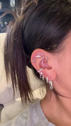 a woman with ear piercings on her ears