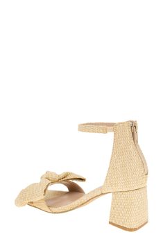 Woven raffia and a voluminous vamp bow lend visual intrigue to a stylish sandal balanced by a squared-off toe and wrapped block heel. 2 1/2" heel Back zip closure Memory foam cushioning Textile upper/synthetic lining and sole Imported Spring Beige Heels With Bow, Spring Beige Bow Heels, Beige Heels With Bow For Summer, Beige Bow Heels For Summer, Summer Beige Heels With Bow, Beige Open Toe Heels With Bow, Bow Sandals With Round Toe For Vacation, Beige Open Toe Sandals With Bow, Spring Evening Sandals With Woven Sole