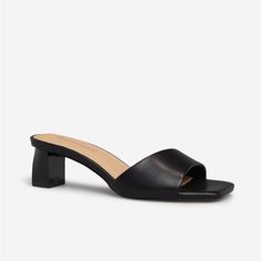 A Slip-On Sandal With A Square Toe And Low Block Heel. Material: Faux Leather Heel Height: 1.75" Platform Height: N/A Measurements Will Vary Slightly Imported Sleek Synthetic Mules With Block Heel, Low Heel Sandals With Padded Heel For Night Out, Night Out Sandals With Padded Low Heel, Sleek Summer Block Heels With Padded Heel, Black Sandals With Sculpted Low Heel, Synthetic Mules With Padded Low Heel, Black Synthetic Low Heel Block Heels, Sleek Low Heel Synthetic Sandals, Sleek Closed Toe Summer Heels