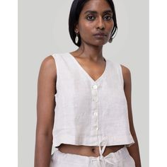 Revive 90s nostalgia with our Reistor Textured Linen Cropped Vest Top, a timeless design that perfectly blends retro charm with contemporary style. This V-neck vest features a regular fit and shell buttons at the front, exuding a classic yet trendy appeal. Embrace the versatility of this piece, ideal for pairing with skirts,pants or shorts for summer outings or layering under jackets for a chic look. Cropped Vest Top, Linen Shorts Women, Boxy Crop Top, Linen Crop Top, Sewing Projects Clothes, Vest Crop Top, Shirt Linen, Shorts For Summer, Balloon Sleeve Top