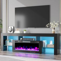 an entertainment center with a fireplace in the middle