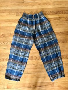 Most amazing women’s vintage express plaid gaucho pants High waisted Buttons at waist and zipper fly Side pockets No pockets in back Excellent vintage condition Ramie and rayon material Tag reads size 7/8 Measurements taken flat are Waist: 12.5 in Hips: 16 in Rise: 16 in Inseam: 26 in Full length: 39.5 in longAll sales are final Thanks for checking out Cereal Vintage Thrift Recycle Reuse Recreate Relaxed Fit Plaid Pants With Elastic Waistband, Vintage Wide Leg Plaid Bottoms, Plaid Relaxed Fit Pants, Plaid Relaxed Fit Trousers, Relaxed Fit Plaid Pants For Fall, Vintage Plaid Pants For Fall, Relaxed Fit Plaid Trousers, Vintage High Waist Plaid Bottoms, Retro Plaid Bottoms With Pockets