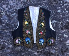 "Beautiful hand-embroidered satin vest High quality and very well made Pair with vintage denim for luxe Woodstock era vibes Fits up to an estimated modern generous medium Please use measurements provided to determine if it will fit the way you like Excellent vintage condition, normal light wear with no significant flaws noted. Antique clothing is absolutely non returnable All items are sold as is with no returns and absolutely no partial refunds. I describe and measure items carefully but may mi Bohemian Vests, Boys Waistcoat, Vintage Leather Vest, Embroidered Vest, 70s Clothing, Future Style, Rocker Style, Antique Clothing, Diy Clothing