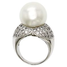 100% Authentic, 100% Customer Satisfaction Height: 15.5 mm Width: 4.5 mm Size: 6 ( Contact Us for Sizing) Metal:14K White Gold Hallmarks: 14K Total Weight: 16.6 Grams Stone Type: 15 mm South Sea Pearl & Approximately 1.10 CT Diamonds Color H-L Clarity SI-I Condition: New Estimated Price: $8500 Stock Number: JB-DR15 Luxury Pearl White Classic Diamond Ring, Luxury White Pearl Drop Ring, Luxury Pearl Ring In Diamond White, Luxury Sterling Silver Pearl Drop Ring, Luxury Pearl White Ring With Diamond Accents, Luxury Pear-shaped Pearl Ring For Anniversary, Luxury High Luster Pearl Engagement Ring, Luxury Pearl Ring With Diamond Accents In Diamond White, Luxury Pearl Ring With Single Cut Diamonds