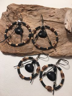 Beaded Wood Dangling Hoop Earrings with Vintage Jet Glass Petal Beads and Stainless Steel Leverback Ear Wires. Mixed wood and coco beads in natural brown bark and dyed black with waxed black hemp cord. Fun and light easy to wear. 2 sizes are available, Large-2 1/2" hoop Small-2" hoop Adjustable Round Beaded Earrings For Festivals, Adjustable Festival Earrings With Wooden Beads, Festival Earrings With Wooden Beads, Adjustable Bohemian Hoop Earrings With Black Beads, Bohemian Adjustable Hoop Earrings With Black Beads, Adjustable Black Beaded Hoop Jewelry, Adjustable Black Beaded Earrings For Festival, Adjustable Hoop Jewelry With Wooden Beads, Adjustable Beaded Earrings For Beach