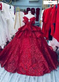 a red ball gown on display in a store