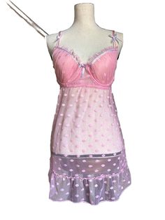 Indulge In A Playful And Comfortable Night's Sleep With This Pink Polka Dot Nightgown. The Gown Features A Sweetheart Neckline, Sleeveless Design, And An Elastic Closure For A Comfortable Fit. Made Of Lightweight Nylon Mesh, This Babydoll Style Gown Has Adjustable Straps And A Padded Bust For Added Support. The Garment Care Instructions Recommend Hand Washing Only. Designed With Charming Accents Including A Ruffle, Bow, And Strap, This Gown Is Perfect For Sleepwear And Lounging Around The House. Summer Coquette Nightgown For Bedtime, Coquette Nightgown For Bedtime In Summer, Coquette Summer Nightgown For Bedtime, Summer Coquette Style Nightgown For Bedtime, Coquette Summer Nightgown For Sleep, Coquette Summer Sleepwear, Coquette Sleeveless Nightgown For Pajama Party, Polka Dot Sleepwear For Pajama Party In Summer, Polka Dot Sleepwear For Summer Pajama Party