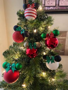 a christmas tree decorated with ornaments and lights