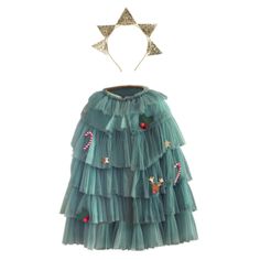 a green dress with candy canes and stars on the top, hanging from a headband