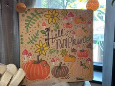 there is a sign that says hello pumpkin with fall decorations on the front and side