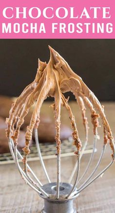 chocolate mocha frosting in a metal whisk