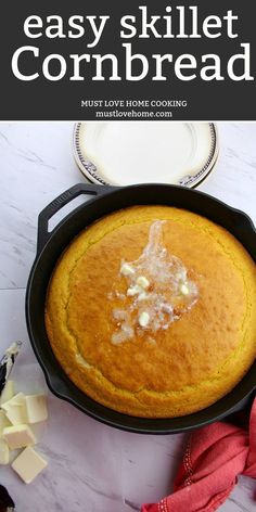 an easy skillet cornbread in a cast iron skillet with butter on top