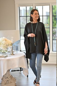 This gorgeous new addition to our Calabria Collection is perfect for a night on the town or dressed down with jeans running errands. Either way you’ll look elegant with classic style. This flowy top is crafted from lightweight viscose fabric for a look that's distinguished yet comfortable. This poncho comes in one size and is 100% viscose. Flowy Top, Essential Bag, Calabria, Flowy Tops, Viscose Fabric, Linen Clothes, Dressed Down, Nightwear, Running Errands