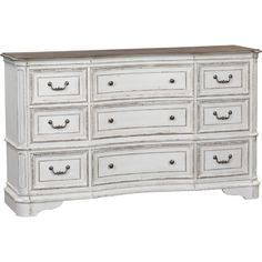 an old white dresser with drawers and knobs