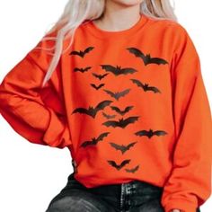 Vintage Bats Sweatshirt: Fly into Spooky Season with Style Red Long Sleeve T-shirt For Halloween, Spooky Orange Crew Neck Top, Fall Novelty Crew Neck Tops, Red Long Sleeve Top For Halloween, Red Long Sleeve Tops For Halloween, Spooky Long-sleeve Orange T-shirt, Halloween Horror Long Sleeve T-shirt, Spooky Orange Long Sleeve T-shirt, Spooky Long Sleeve Orange T-shirt