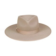 Lack of Color Zulu Rancher. Inspired by vintage men’s styles, this hat is designed to make a statement. A stiffened wool fedora with rigid crown design. Trimmed on hat and rim with tonal grosgrain ribbon. Sand Rancher fedora hat.Trimmed with tonal sand grosgrain edged hat rim and bow ribbon detail. 100% soft Australian woolSpot / specialist cleanBrim measures 10 cm / 3.95”Classic crown heightRigid crown designUnisex styleThis hat is accredited with a UPF Rating 50+ (Australian Tested) Size + Fit: Rancher sizing runs slightly wide/large due to crown design Sizing runs approx. 0.5-1cm larger than tagged size E.g. - a 55cm tagged Rancher's true measurement is 55.5 - 56cm Please size down or add a hat filler if you are in-between sizes. Flat Crown Fur Felt Fedora, Classic Panama Hat With Flat Crown For Winter, Classic Solid Boater Hat With Flat Brim, Classic Boater Hat With Flat Brim, Flat Brim Fur Felt Hat, Solid Fur Felt Hat With Flat Crown, Fur Felt Hat With Flat Crown, Classic Beige Fedora Felt Hat, Solid Curved Brim Fur Felt Fedora