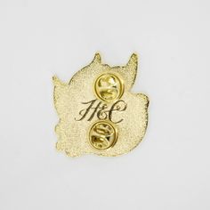 This glossy enamel pin features a bright lemon inspired by our classic Lemons story. It’s the perfect addition to any outfit or bag and also makes a great gift. Enamel pin comes with a metal military clutch closure. High polish gold finish. Approx. 1.5" x 1.5" Gold Novelty Brooches For Gifts, Gold Party Brooch Pin, Gold Enamel Lapel Pin, Personalized Gold Pins For Gifts, Yellow Enamel Brooches For Gifts, Gold Enamel Pin With Metal Pinmount Logo, Gold Enamel Brooch Pin, Silver Lapel Pin With Metal Pinmount Logo For Gift, Silver Lapel Pin With Metal Pinmount Logo As Gift