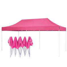 a pink tent with four umbrellas attached to it