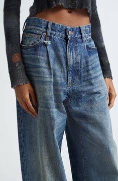 A pleated waist and articulated darts at the knees bring structure to the wide-leg silhouette of these relaxed jeans cut from distressed, nonstretch denim. 32" inseam; 21" leg opening; 14" front rise; 17 1/2" back rise (size 29) Zip fly with button closure Five-pocket style 100% cotton Machine wash, line dry Imported Designer Clothing Winter Favorites, Pleated Jeans, R13 Denim, Closet Wardrobe, Denim Inspiration, Designer Denim, Womens Denim, Denim Day, Relaxed Jeans