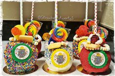 there are three cakes decorated with candies and lollipops