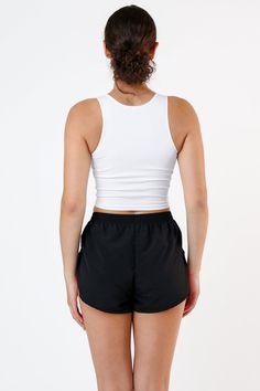 This crop tank is made of a heavy 2x1 rib with spandex so it has a flattering stretch. This textile features more compression than our regular cotton spandex styles and has been garment dyed and washed, so it is shrink-free, in 3 basic colors for your wardrobe. Compared to our regular 100% cotton 2x1 crop tank, this garment is better for working out and has a sexier, tighter fit. Made in Los Angeles, Calif. Our experienced seamstresses earn an average up to $20 an hour or more and no less than $ Black Sleeveless Crop Top, Black And White Baby, Cool Tanks, Black Turtleneck, Sleeveless Crop Top, Basic Tops, Black Sleeveless, Basic Colors, Crop Tank