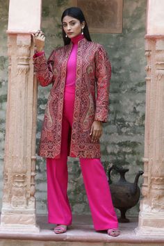 Red pashmina long jacket with handwoven floral and paisley motifs.
Component: 1
Pattern: Hand Woven
Type Of Work: Thread
Neckline: Band Collar
Sleeve Type: Full
Fabric: Pashmina
Color: Red
Other Details: 
Paisley and floral motifs
Open front jacket
Note: The inner top and pant worn by the model is not for sale
Occasion: Party - Aza Fashions Festive Long Fitted Outerwear, Elegant Long Kurta For Fall, Fitted Long Outerwear For Festive Season, Elegant Kurta With Zari Work For Fall, Elegant Fall Outerwear With Zari Work, Traditional Silk Outerwear For Fall, Elegant Festive Straight Kurta Outerwear, Elegant Designer Winter Outerwear, Elegant Fall Outerwear