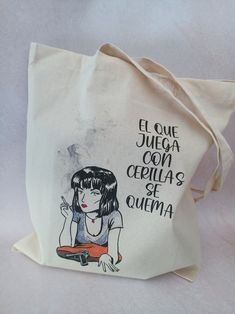 Fabric bag with an original illustration and designed by Angelatinosa Art made with gouache, then digitized. This canvas bag with an illustration of Beetlejuice is perfect to carry all your stuff, it is very resistant (160g / m2) of 100% natural cotton. Made in Spain. Size is approximately 38x42 so it has a large capacity. Packaged with much care and love. All my orders carry some surprises. Thank you very much for visiting my space and seeing my work. Back to the shop: www.etsy.com/shop/angelatinosaart White Screen Printed Bag As Gift, White Screen Print Bag As Gift, Graphic Print Rectangular Canvas Bag Gift, White Hand Printed Bags As Gifts, Hand Printed Cotton Bag For Gift, White Hand Printed Bags For Gifts, White Hand Printed Bag For Gift, Affordable Eco-friendly Canvas Bag With Graphic Print, Shakespeare And Company Tote Bag