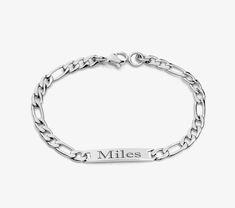 Our silver children's ID bracelets can be custom engraved on both sides. This personalized silver bracelet is for a smaller wrist. Metal: Surgical Stainless Steel High Polished Silver Design: ID Plate Chain-type: Figaro Length: 6 inches (please measure wrist prior to purchase) Clasp: Lobster claw clasp Engraved jewelry for girls and boys. Our Stainless Steel engraved ID bracelets are a popular gift for all occasions. With a variety of styles and sizes you can be sure to get the perfect engraved Personalized Silver Bracelets, Silver Baby Bracelet, Jewelry For Girls, Medical Bracelet, Kids Bracelets, Baby Bracelet, Silver Design, Id Bracelets, Engraved Bracelet