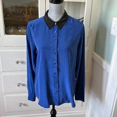 Beautiful $325 Equipment Femme France 100% Silk Shirt L Royal Blue With Black Collar. The Shirt Is Brand New, But It Does Have A Couple Of Marks From Shopwear That I Was Going To Have Dry Cleaned Out After I Purchased This, But Never Ended Up Doing. Blue Really Isn’t My Color. I Just Thought The Shirt Was So Beautiful. Because Of The Issues I Am Listing. This Is A Very Low Price, But I’m Open To Reasonable Offers. Check Out My Closet To Bundle And Save Even More. I’m Really Great Items. Play Flat This Shirt Measures 21 1/2 Inches From Armpit To Armpit, Total Length Down The Center Back Is 29 Inches Chic Blue Blouse With Spread Collar, Blue Spread Collar Blouse For Fall, Fitted Button-up Top With Contrast Collar, Workwear Shirt With Contrast Collar, Fitted Tops With Contrast Collar And Button-up, Blue Spread Collar Top For Work, Black Top With Contrast Collar For Work, Workwear Top With Contrast Collar, Chic Blue Workwear Shirt