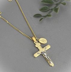 ♦  1.5" Gold Scroll Crucifix, made in Italy ♦  Gold plate Crucifix ♦  Gold plate chain w/ clasp ♦  Select 16 or 18" chain ♦  Optional: add a Miraculous Medal ♦  Comes in a gift box FLAT RATE SHIP add another item at NO additional cost Find other great items at  https://www.etsy.com/shop/MyLadyTreasures Gold Metal Cross Charm Necklaces, Gold Cross Pendant Charm Necklace With Adjustable Chain, Gold Charm Necklace With Cross Pendant And Adjustable Chain, Gold Charm Necklaces With Cross Pendant And Adjustable Chain, Gold Metal Crucifix Cross Necklace, Metal Crucifix Necklace As Gift, Gold Cross Necklace With Chain As Gift, Nickel Free Metal Crucifix Necklace, Cross Shape Charm Necklace As A Gift