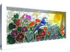 a glass panel with flowers and birds on it's side, in front of a white background