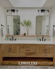 a bathroom with two sinks and mirrors in it