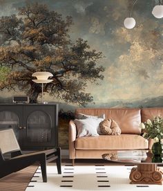 a living room with a couch, coffee table and painting on the wall