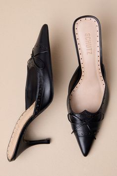 The Schutz Minny Black Nappa Leather Bow Pointed-Toe Mule Pumps are exquisite, elegant, and perfect for all your classier looks! Smooth genuine leather shapes these too-perfect pumps that feature a pointed-toe upper with a dainty bow, a scalloped collar, and delicate punched details throughout. A stunning stiletto heel completes the chic design! 3" wrapped stiletto heel. Lightly cushioned insole. Genuine leather sole has nonskid markings. Genuine leather upper, lining, and sole. Balance man made Evening Closed Toe Calf Leather Kitten Heels, Calf Leather Closed Toe Kitten Heels For Evening, Evening Calf Leather Closed Toe Kitten Heels, Elegant Kitten Heels With Leather Sole And Round Toe, Elegant Kitten Heels With Round Toe And Leather Sole, Classic Evening Kitten Heels With Padded Heel, Classic Closed Toe Kitten Heels For Evening, Classic Evening Kitten Heels With 4-inch Heel, Classic Evening Kitten Heels With Almond Toe