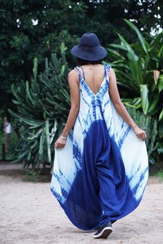 "Sleeveless Backless Tie Dye Jumpsuit for Summer Beautiful and breathable 100% double gauze cotton fabric, hand tie-dyed with indigo eco dye Shibori technic. Sizing: Made in one size to fit M to XXL / US: 6/8/10/12/14/16/18 Measurement; Chest up to 48\" Hip max 49\" Length does not include the strap outseam 33\" Length from top to the longest part (middle) 56\" Leg hem circumference 80\" **Model is a size US 6, 33\" bust, 35\" hip, 165 cm Tall. ** Very flattering flowy jumpsuit with lots of flow Cotton Jumpsuits And Rompers For Vacation, Flowy Bohemian Jumpsuits And Rompers For Summer, Bohemian Flowy Sleeveless Jumpsuits And Rompers, Bohemian Flowy Sleeveless Jumpsuit/romper, Flowy Sleeveless Bohemian Jumpsuit/romper, Bohemian Sleeveless Flowy Jumpsuit, Bohemian Flowy Sleeveless Jumpsuit, Sleeveless Cotton Jumpsuit For Vacation, Sleeveless Cotton Jumpsuits And Rompers For Vacation