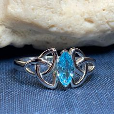 TAKE AN ADDITIONAL 20% OFF THE ALREADY REDUCED SALE PRICE - ADDITIONAL 20% IS DEDUCTED AT CHECKOUT with code SAVE20 A unique design combining the traditional elements of the trinity knot with a modern twist. Solid sterling silver with a beautiful blue topaz or diamond zirconia stone. Choose from sizes 6-9 Irish Ring, Trinity Knot Ring, Bride Ring, Celtic Knot Jewelry, Knot Jewelry, Irish Rings, Celtic Ring, Life Jewelry, Tree Of Life Jewelry