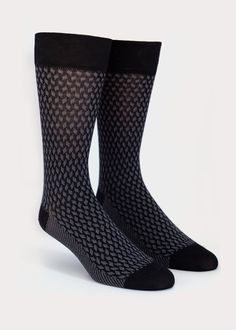 Luxe mid-calf high dress socks for men. Fabricated with the finest mercerized cotton. With a subtle jacquard pattern, the Pin & Needles men's dress sock is perfect for casual days and elegant nights. Details: Size Guide One size fits most.Recommended Men's US shoe size 7 - 12, Euro 39 - 45. Materials 65% Cotton, 34% Nylon, 1% SpandexMade in China Care Instructions Machine wash on perm press, no chlorine bleach,hang dry recommended. Elegant Fitted Mid-calf Socks, Black Business Socks For Winter, Black Fitted Classic Socks, Formal Black Stretch Socks, Elegant Formal Stretch Socks, Modern Fitted Black Socks, Classic Winter Socks For Formal Occasions, Classic Formal Socks For Winter, Fitted Black Business Socks