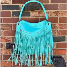 Light Turquoise In Color. Fringe With Silver Studs And Conchos. Spacious. Zipper Closure. One Inside Zipper Pocket. Two Outside Zipper Pockets. Faux Leather. Great Condition. Never Used. Nwot. Summer Blue Fringe Bag, Louis Vuitton Bum Bag, Confetti Bags, Tan Shoulder Bag, Crochet Shoulder Bag, White Tote Bag, Faux Leather Bag, White Tote, Black Leather Purse