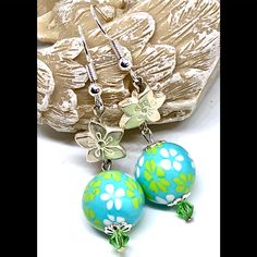 New Handmade Earrings Feature Upcycled Sky Blue Acrylic Beads With Fun Lime Green And White Floral Patterns. Whitewashed Silver Tone Metal Flowers And Light Green Crystal Bicones Complete This Fresh Look. Length Including Hooks 2.18”. Summer Blue Beaded Flower Earrings, Blue Beaded Flower Earrings For Summer, Green Flower-shaped Beach Earrings, Green Flower-shaped Earrings For Beach, Turquoise Beaded Jewelry For Spring, Green Flower Earrings For Beach, Blue Flower-shaped Jewelry For The Beach, Blue Flower-shaped Summer Earrings, Blue Flower Shaped Earrings For Summer