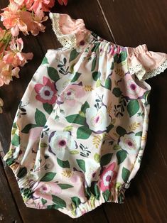 This listing is for a custom made baby girl bubble romper. This can be made in sizes newborn to a toddler 3T.  I have many fabric options and can do any combination or style to fit your needs.  In the notes to seller section at checkout, please include: - The size needed - date that you need the item - fabric changes (if any) Spring Bubble Romper With Ruffles And Flutter Sleeves, Cute Floral Print Onesie For Summer, Fitted Short Sleeve Bubble Romper For Spring, Cute Spring Bodysuit With Ruffles, Cute Short Sleeve Bodysuit For Spring, Cute Floral Print Bodysuit For Spring, Floral Print Fitted Cotton Bubble Romper, Spring Sleeveless Onesie With Ruffles, Sleeveless Spring Onesie With Ruffles