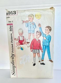 an old children's sewing book with pictures of boys in blue and red outfits