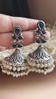 Very Fine Oxidized Silver Plated Jadau Cz Stones with Pearl Blue & Silver Jhumki / Indian Bollywood Style Earrings / Afghani Tribal Earrings Gorgeous Dangle Oxidized silver  earrings - Contemporary earrings with simulated stones in silver finish. - Very Elegant and stylish, these earrings can be paired with any traditional Indian or Western Attire depending upon the occasion and the theme. - The base is pure brass (90%) and pure 92.5 silver (10%) which makes this very sturdy and of good quality. - 100% guarantee on the polish- it will not lose its finish/color/shine. - Very lightweight and Hand carved. Its a very Fine Quality of silver long jhumke  Highest quality and craftsmanship, Ready to ship from India  Please contact us any questions Contemporary Silver Earrings, Oxidized Silver Earrings, Contemporary Earrings, Bollywood Style, Indian Bollywood, Oxidized Silver, Traditional Indian, Style Earrings, Bollywood Fashion