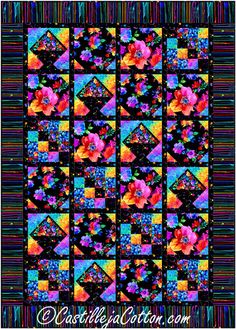 a colorful quilt with flowers on the front and back, as well as a black background